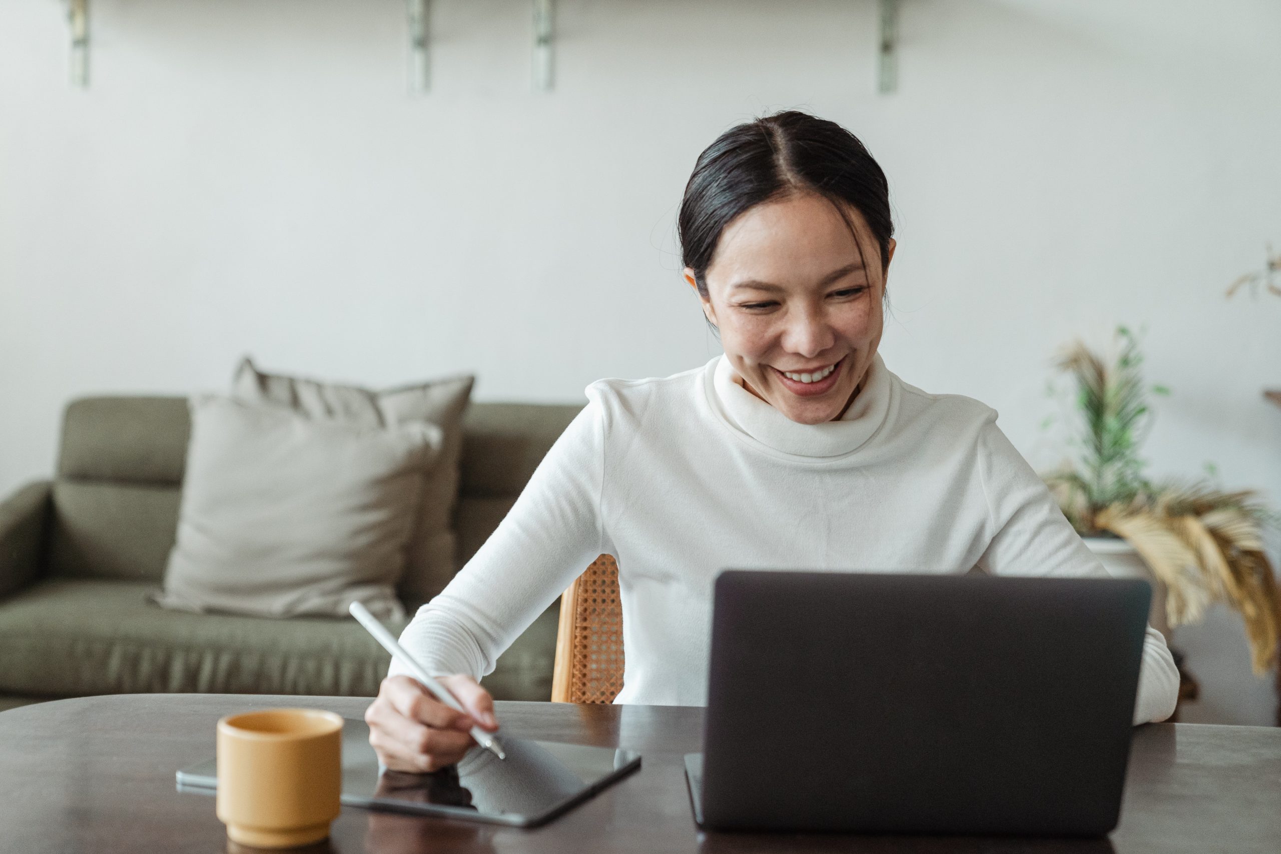 Woman working from home looking happy